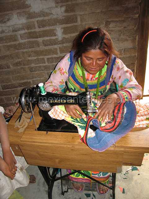 cora_pastor_01.JPG - Since there is no electricity at in this village , treddle sewing machines are still used.