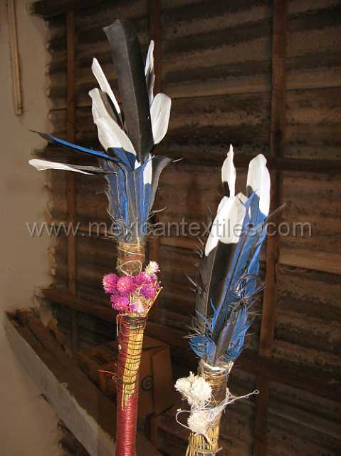 cora_ceremony_02.JPG - The top of the poles carried by the "Malinches" magpie and bluejay featers flowers and bells.