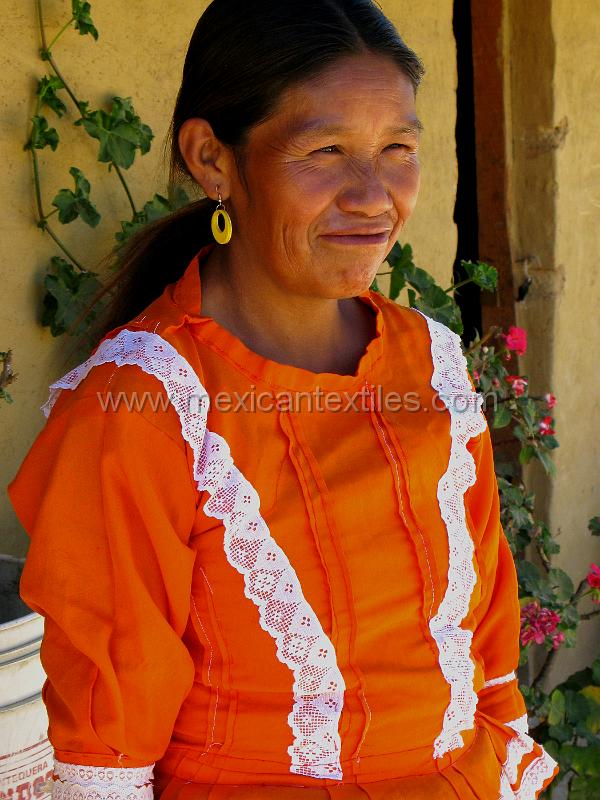 tepehuano_woman_03.JPG - Documentation of tepehuano indigenous textiles from Huajicori, Nayarit, Mexico. The small apron accent the colorful costume