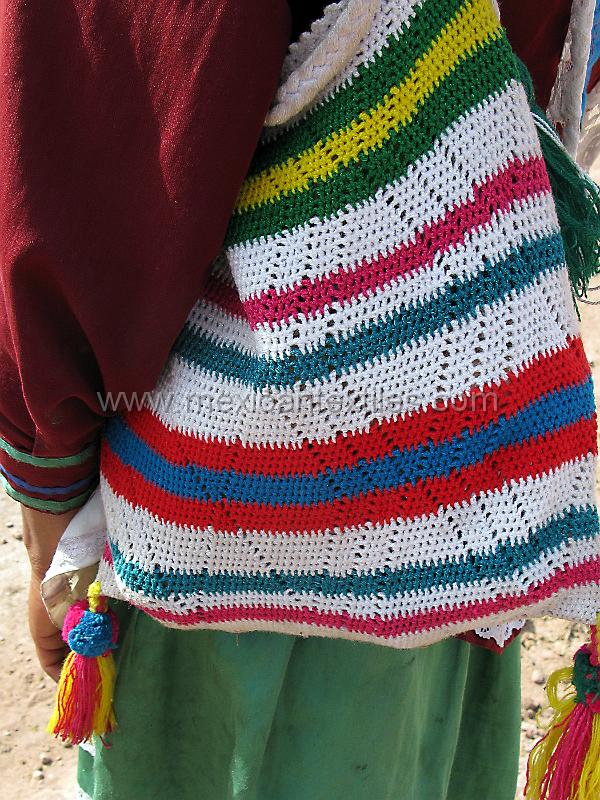 tepehuano_bag.JPG - Documentation of tepehuano indigenous textiles from Huajicori, Nayarit, Mexico. This mulicolored bag has a wonderful knotted tassel and expands to carry lots of items.