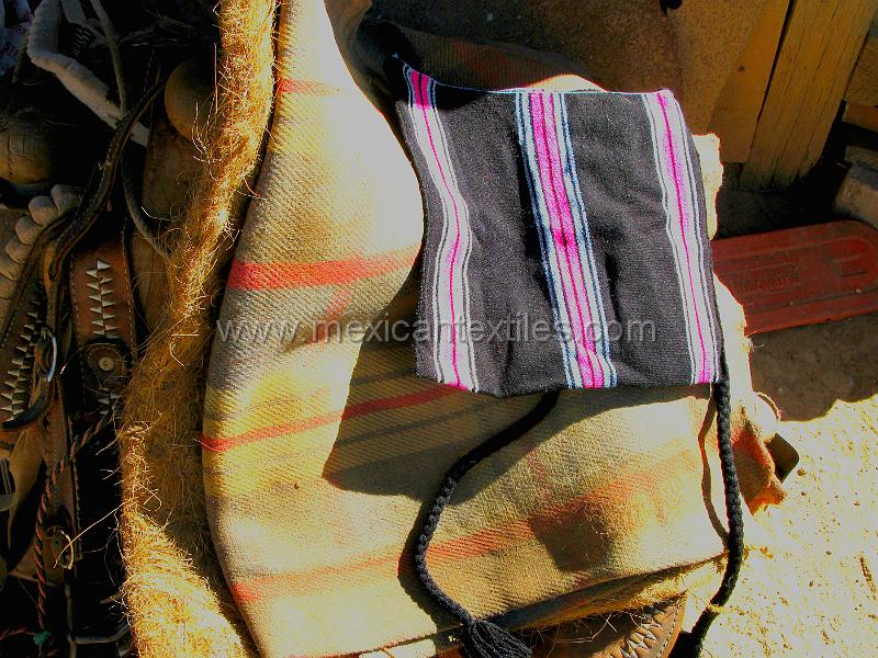 tepehuano_craft_05.JPG - Documentation of tepehuano indigenous textiles from Huajicori, Nayarit, Mexico. tepehuano bag on a saddle blanket.