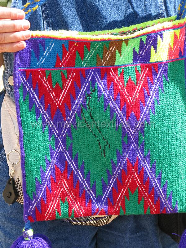 tepehuano_bag_01.JPG - Documentation of tepehuano indigenous textiles from Huajicori, Nayarit, Mexico. Kristy my travel partner is holding a bag for sale. it was a wonderful piece however the closest bank was 5 hours away to the westt and 12 hours away to the east.