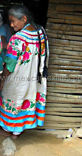 ayutla_mazateca_07.jpg - This huipil is worn but has some really nice flowers embroidered on it.