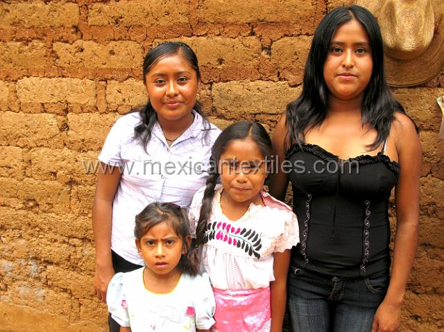 Mazateca_barriopanteon__07.JPG - Close up of the family , on the left is my guide who took us around the area to help take photos of the area and its costumes. She goes to school in Oaxaca City and was there on vacation. The town is 40 miles down a dirt road at the edge of the Mazateca region