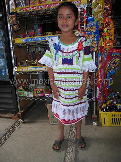 huautla_mazateca__18.JPG - A vendor from Jaalapa de Diaz on market day brought her daughter in the traditional costume of Jalapa.