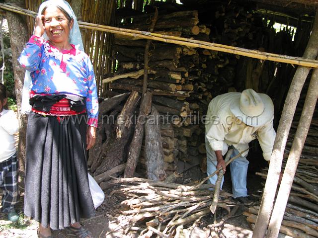 nahua_tlaquimpa_10.JPG - Manuela and her husband in the shed where they keep the firewood.