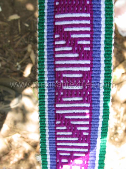 nahua_tlaquimpa_16.JPG - The woven symbol in the center of the belt that looks like a H is the symbol for a weaver.