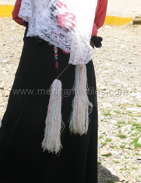 nahua_xochitlaxco_12.JPG - Hair briaed with a woven strip and tassel, traditional in this region.