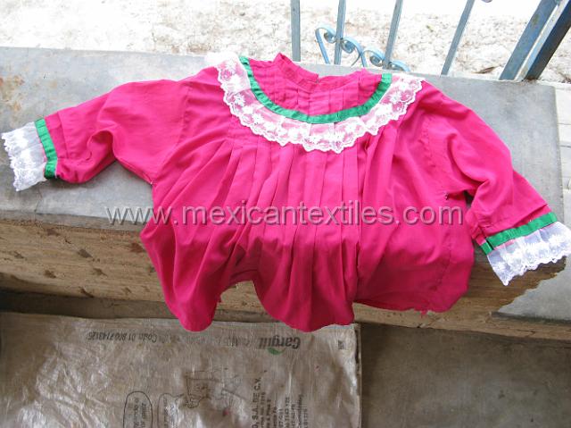 ahuelican_nahuatl06.JPG - The round collar and lace on the cuffs stand out here.
