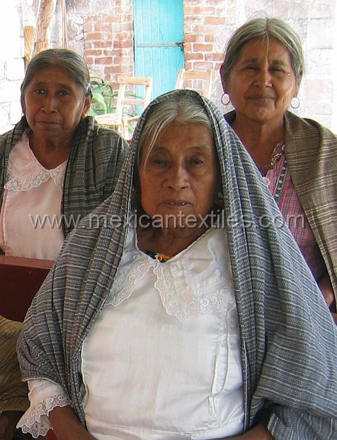 Tetelcingo_i.jpg - Worshiper wearing a traditional blouse, notice at the neck line a colorful blouse underneath.