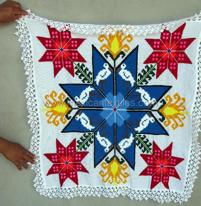 sn_antonio_embroiderey_32.JPG - Otomi indian embroidery from San Antonio Huehuetla, Hidalgo, totilla cloth with Otomi star design corn, storks and double stars.